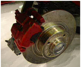 A disc brake. The rotor is the shiny gold-colored disc and the caliper is red. The black piece between thecaliper and the rotor is the pad. 
