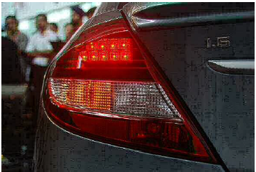 Rear lights of a vehicle with the brake lights illuminated